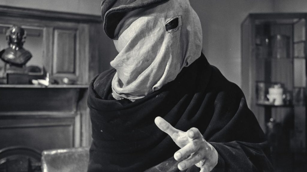 John Merrick se cachant sous un masque